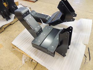 Boom cradle for agricultural spray booms